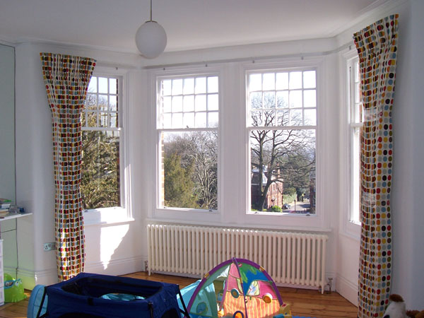 36mm metroflat fitted to bay window with blackout lined, pinch pleat curtains dressed and tied to set the pleats
