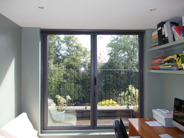 Duette blinds fitted at modern folding doors in London