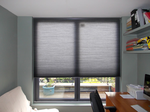 Duette blinds fitted at modern folding doors in London