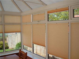 Pleated blinds fitted to each window