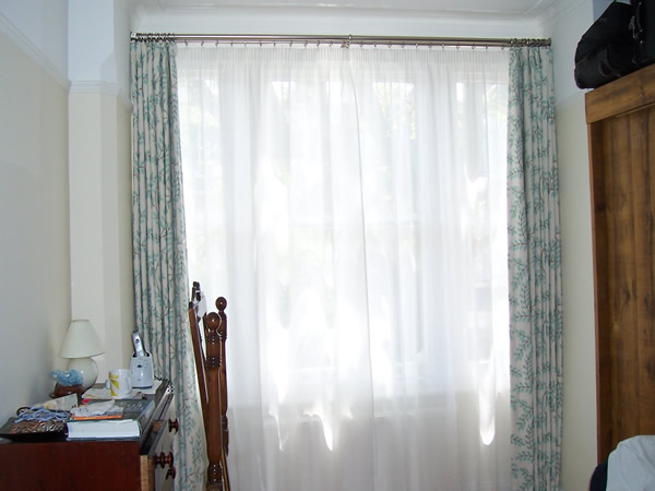 double poles with curtains hung