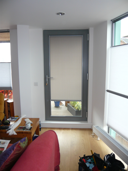 Luxaflex Nano blind fitted to a door in London, covering top two thirds