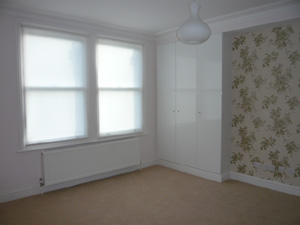 simple white roller blinds installed in Muswell Hill - Finchley