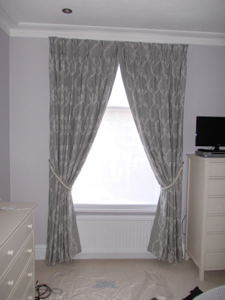 Interlined curtains tied back for a more dramatic effect