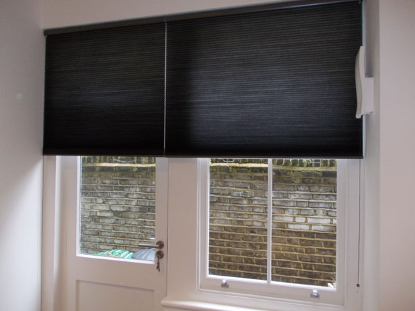 side by side duette blinds partially lowered